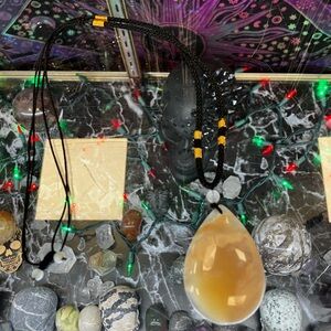 Black and Gold Beaded Necklace with Teardrop Pendant